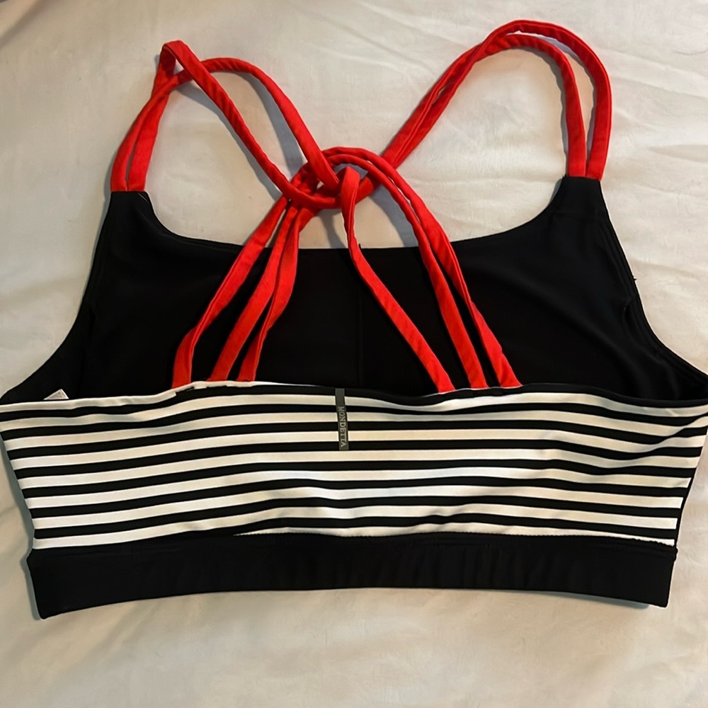 Mondetta Black Sports Bra with Black and White Striped detail and Red Straps